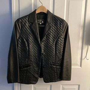 Black Leather Italian jacket, size 2-4, European size 42. Never worn. Unusual !